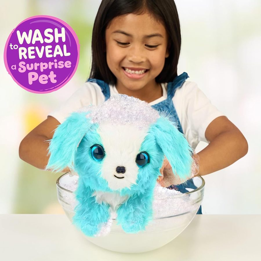 A girl washing a blue ScruffaLuvs pet in a bowl of soapy water